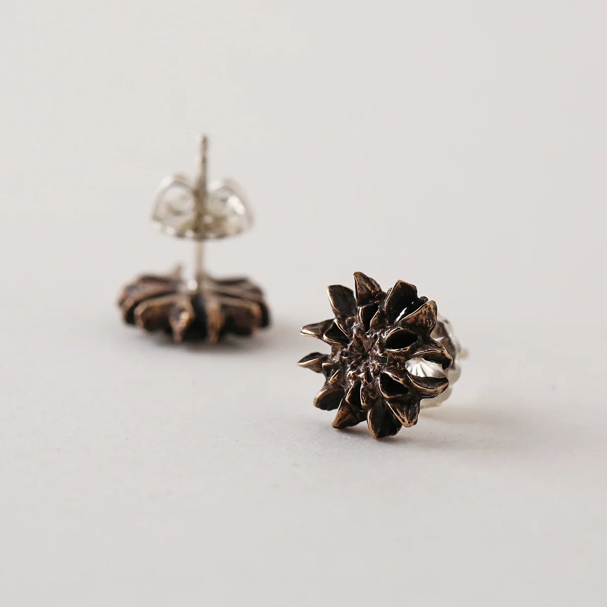Pinecone Snowflake Stud Earrings in Patina Silver - Heart of the Home Inc