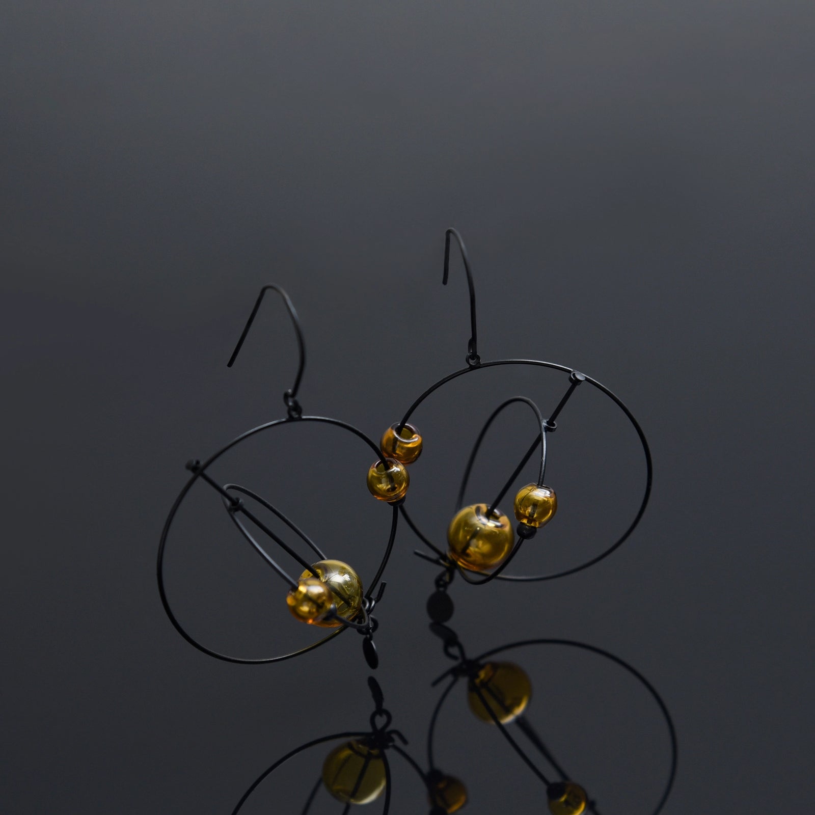 Amber Rove Kinetic Earrings - Heart of the Home Inc