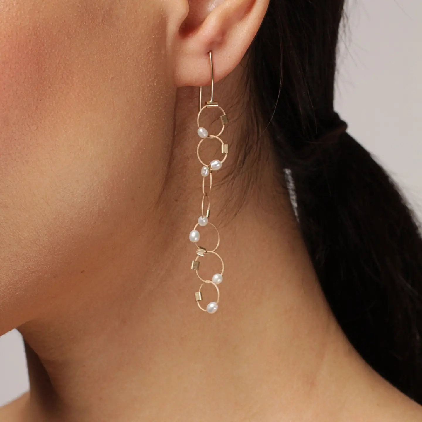 Interlock Long Earrings in Gold & White Pearl