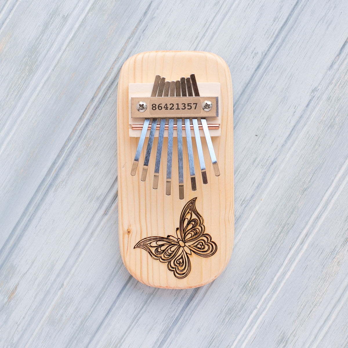 Butterfly Engraved Pine Thumb Piano - Heart of the Home PA